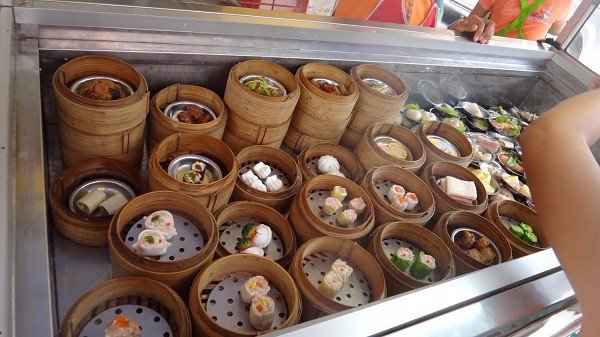 Choosing-from-the-many-steamers-of-Dim-Sum-on-offer.